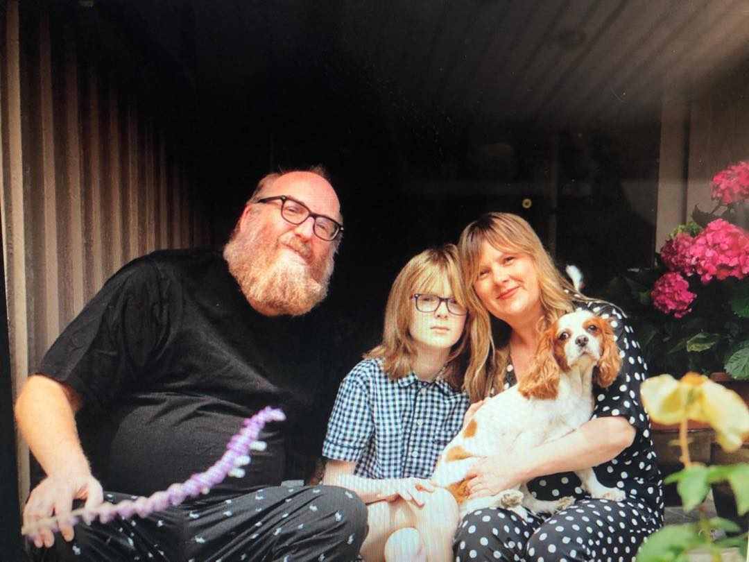 Image of American entertainer, Brian Posehn with his family